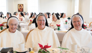 SISTERS ENJOY CHRISTMAS MORNING BREAKFAST TOGETHER IN THE REFECTORY.