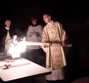 Easter Vigil: Father Chrismer lights the Paschal candle from the holy fire.