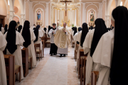 Easter Vigil: Father Chrismer blesses the congregation with holy water after the renewal of baptismal promises.