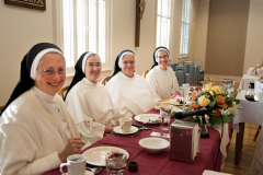 Sister Mary Christopher enjoys a festive breakfast with Sister Catherine Marie, Mother Anna Grace, and Sister Anne Catherine in celebration of her 50th anniversary of vows.