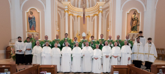 The sisters pose with Bishop Michael Izen, Archdiocese of Minneapolis St. Paul, the priest concelebrants, and the altar servers