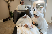 30-After the ceremony, the professed sisters greet the new novices.