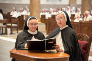 24-Sister Mary Laura professes her vows publicly as she kneels next to Mother Anna Grace.