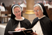 26-Sister Maura Sheen professes her vows publicly as she kneels next to Mother Anna Grace.