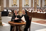 27-Sister Maura Sheen professes her vows publicly as she kneels next to Mother Anna Grace.