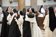 31-The community greets the sisters in the sign of peace following their profession of vows.