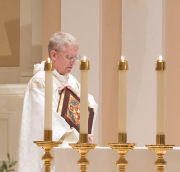 Father James Brent, O.P. prepares to read the Gospel.