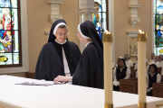 Sister Aimee Marie with Mother Anna Grace, after she signed her vows on the altar.