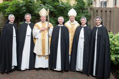 Bishop Spalding, Archbishop Fisher, Mother Anna Grace, and the four sisters who will profess their vows perpetually at this Mass, pose for a photograph before Mass. Bishop Spalding, Archbishop Fisher, Mother Anna Grace, and the four sisters who will profess their vows perpetually at this Mass, pose for a photograph before Mass.