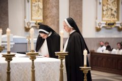 The sister signs her vows on the altar in the book of profession. The sister signs her vows on the altar in the book of profession.