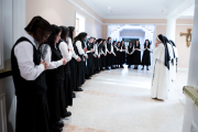 Mother Anna Grace, Sister Mary Rachel, and Sister Marie Hannah pray with the postulants before they receive the Dominican pin during their pinning ceremony, marking the beginning of their postulancy.