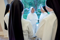 The sisters greet the new novices and learn about the significance of their religious names and feast days.