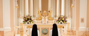 sisters in adoration before the Blessed Sacrament