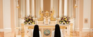 sisters at prayer before the Blessed Sacrament