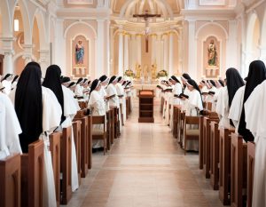 Dominican sisters at prayer with the Blessed Sacrament in the monstrance on the altar